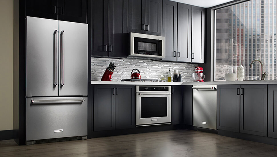 Kitchen with Black Cabinets and KitchenAid Stainless Steel Appliances